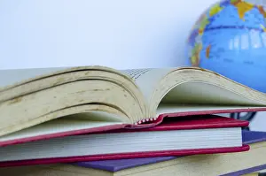 Text Free Space Photo Drucke: Close up of stake of books with customizable space for text
