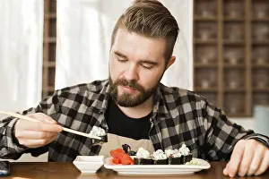 Asian Cuisine Meal Ideas Drucke: Close up of sushi rolls on a table in a restaurant