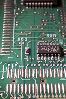 Microchip Detail View Drucke: Close-up of green electronic computer circuit board with microchip