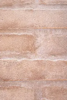 Exterior View Of Building Facade Drucke: Close-up image of a rough beige stone surface