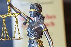 Weighing Scale Concept Drucke: Close-up of a Justitia in front of the civil code