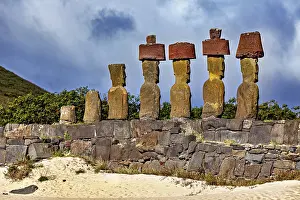 Easter Island Moai Drucke: Close-up of Moai statues on Easter Island under a dramatically cloudy sky