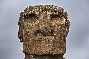Moai Statue Drucke: Close-up of a moai surrounded by clouds with a weathered surface