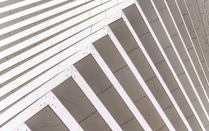 Low Angle View Architecture Drucke: Close-up of a modern architectural facade featuring diagonal lines creating a dynamic pattern