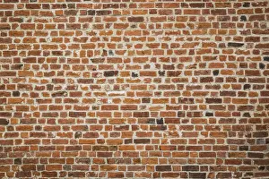 Construction Material Images Drucke: Close-up of red brick wall, background image