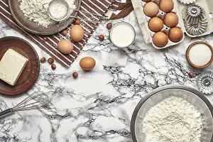 Marble Table Background Drucke: Close-up shot. Top view of a baking ingredients and kitchenware on a marble table background