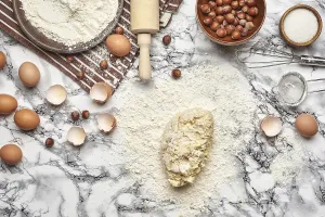 Kitchen Food Photography Drucke: Close-up shot. Top view of a kitchenware and baking ingredients on a marble table background