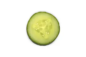Bright Light Food Photography Drucke: Close-up of a single cucumber slice