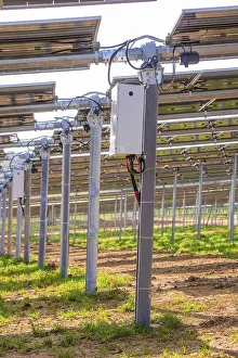German Farmland Photography Drucke: Close-up of solar panel structures with electrical components on green field
