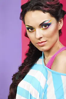 Beautiful Brunette Model Drucke: Closeup portrait of a beautiful model with creative dynamic multicolor make up