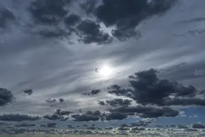 Central European Cloud Formations Drucke: Cloud formations with sun behind a cloud cover