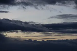 Deserted Evening Atmosphere Drucke: Cloud hole at sunset, bizarre clouds