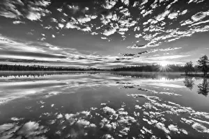 Lapland Forest Lake Drucke: Cloud reflection in a forest lake