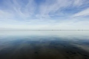 Cloudy Sky Reflections Drucke: Cloud reflection in the mudflats