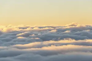 Top Down View Of Clouds Drucke: Clouds from above, evening mood