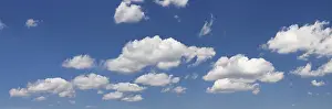Cloudy Blue Sky Photo Drucke: Clouds against a blue sky