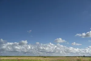 Deserted German Beach Drucke: Clouds above the lagoon landscape