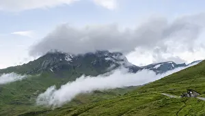 Bernese Oberland Mountains Drucke: Clouds move around mountain peaks