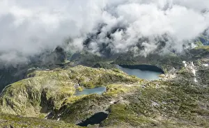 Cloudy Mountain Lake View Drucke: Clouds passing over a ridge with mountain lakes