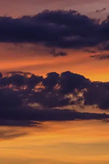 Cloudy Evening Scene Drucke: Clouds at the red evening sky after sunset