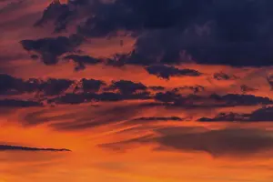 Clouds At Sunset Drucke: Clouds at the red evening sky after sunset