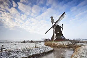 Cloudy Sky Landscape Drucke: Cloudscape over Dutch windmill in Groningen