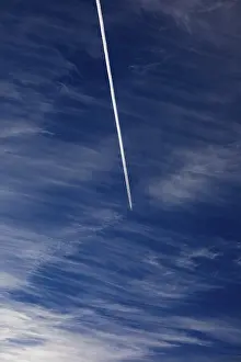 Cloudy Sky With Contrails Drucke: Cloudy sky with contrails, cirrus clouds or feather clouds