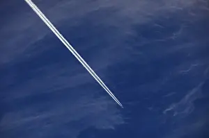 Cloudy Sky With Contrails Drucke: Cloudy sky with contrails, cirrus clouds or feather clouds
