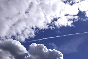 Cloudy Skies In Germany Drucke: Cloudy sky with contrails, Germany