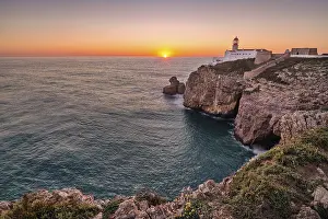 European Coastal Photography Drucke: Coast with lighthouse at sunset