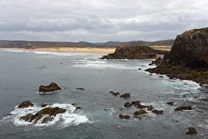 Overcast Sky Landscape Photo Drucke: Coast with rocks and waves under a cloudy sky