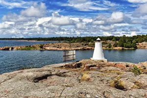 Aland Islands Finland Drucke: Coastline with lighthouse on rocks