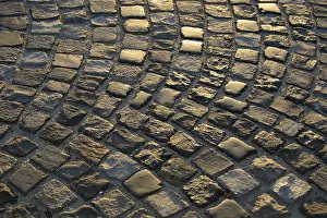 Sunset Photography Drucke: Cobblestone road the setting sun