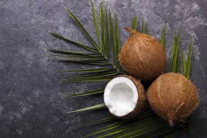 Healthy Eating Photography Drucke: Coconut over black rustic background