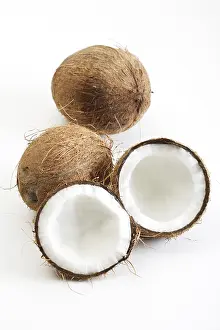 Coconut Nutrition Drucke: Coconuts, one halved, palm leaf
