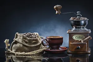 Antique Coffee Mill Drucke: Coffe mill cup and sack with beans on mirror table