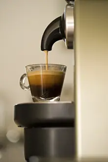 Coffee Preparation Method Drucke: Coffee cup being filled in a coffee machine