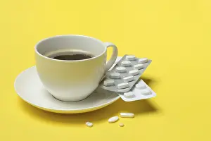 Healthcare System Risks Drucke: Coffee in a cup and medication