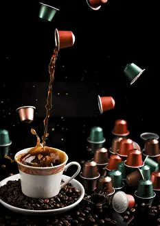 No People Coffee Scene Drucke: Coffee flows from a floating capsule into a cup