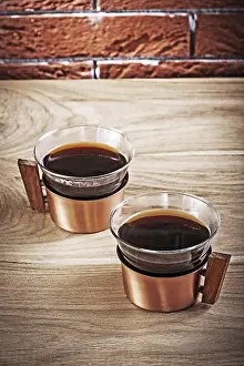 Antique Tableware Drucke: Coffee in old copper cups on the table