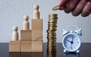 Business Concept Image Drucke: Coins Stack with wooden doll model