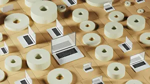 Digital Innovation Hub Drucke: A collection of laptops placed among abstract geometric forms
