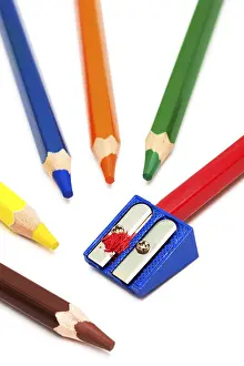 Colored Pencils Drucke: Colored pencils and sharpener on a white background