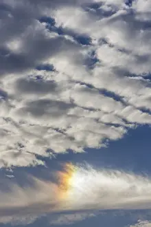 Cloudy Weather Europe Drucke: Colored sun reflection on a cloudy sky, Germany
