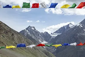 Mountain Trekking Adventure Drucke: Colorful prayer flags flutter in the foreground