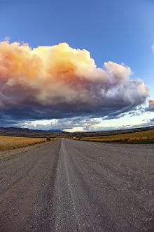 South American Weather Forecast Drucke: Colossal thundercloud is pierced by lightning strikes and illuminated by the sunset