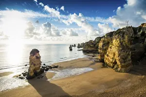Colourful Rock Formations Drucke: Coloured cliffs and sunrise at the beach