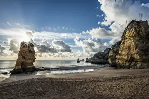 Morning Light On Rocks Drucke: Coloured cliffs and sunrise at the beach