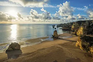 Colourful Rock Formations Drucke: Coloured cliffs and sunrise at the beach