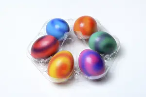 Christian Tradition Drucke: Coloured eggs in plastic packaging